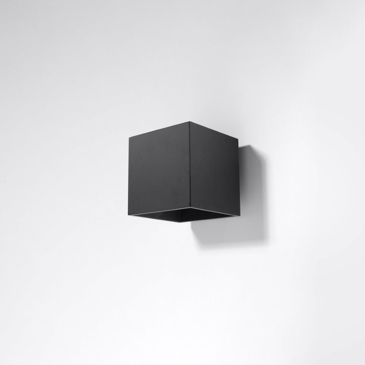 Sollux Lighting modern black cube wall light mounted on white wall with minimalist design
