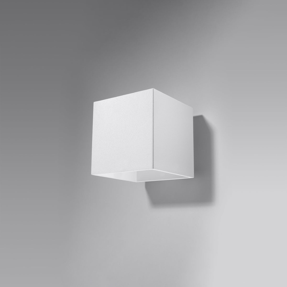 Modern cube white wall lamp by Sollux Lighting with minimalist geometric design mounted on gray wall