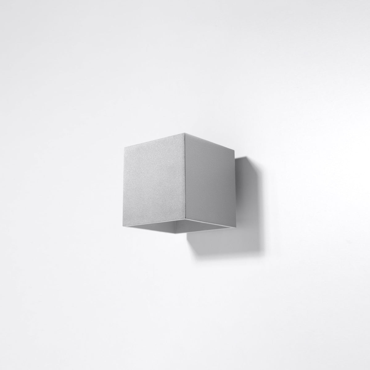 Sollux Lighting modern grey cube wall lamp mounted on a white wall with minimal design