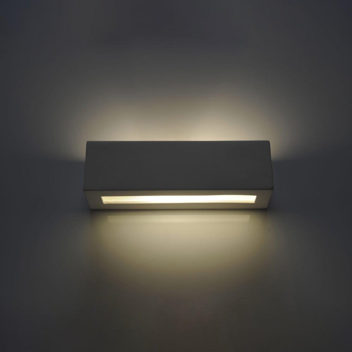 VEGA ceramic wall sconce by Sollux Lighting with modern rectangular design emitting soft ambient light