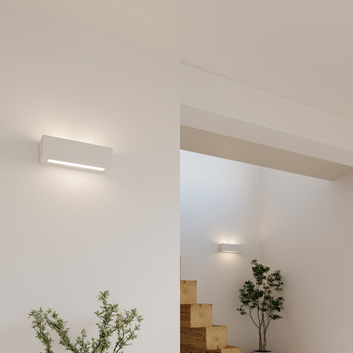 VEGA ceramic wall sconce by Sollux Lighting illuminating a modern minimalist staircase area with plants