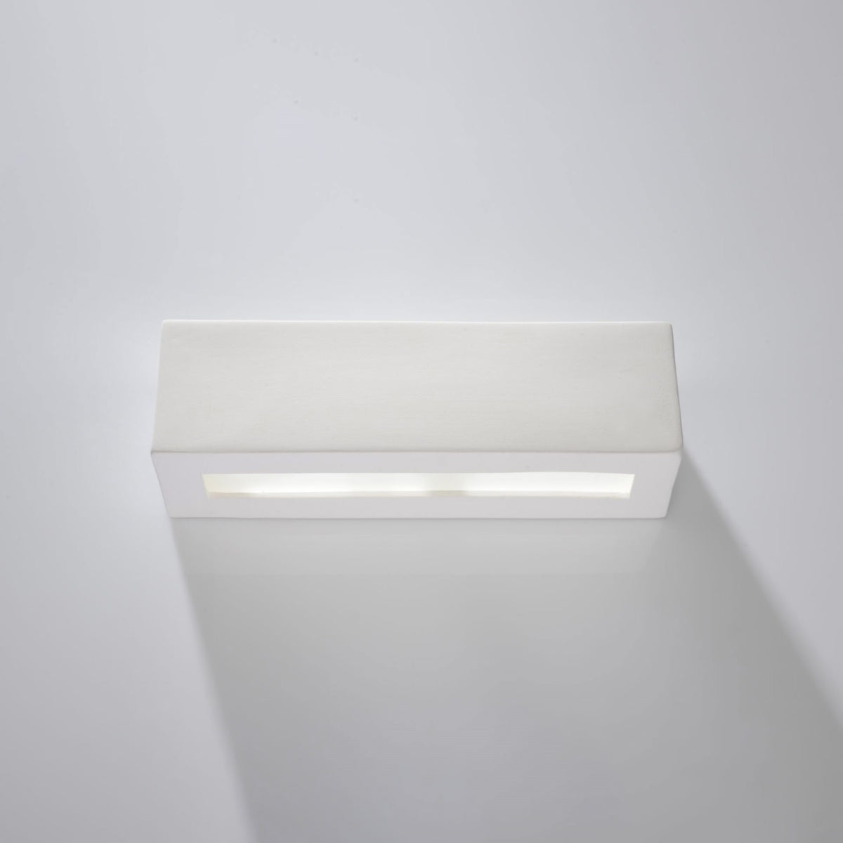 Sollux Lighting VEGA ceramic wall sconce in white with sleek rectangular design mounted on wall