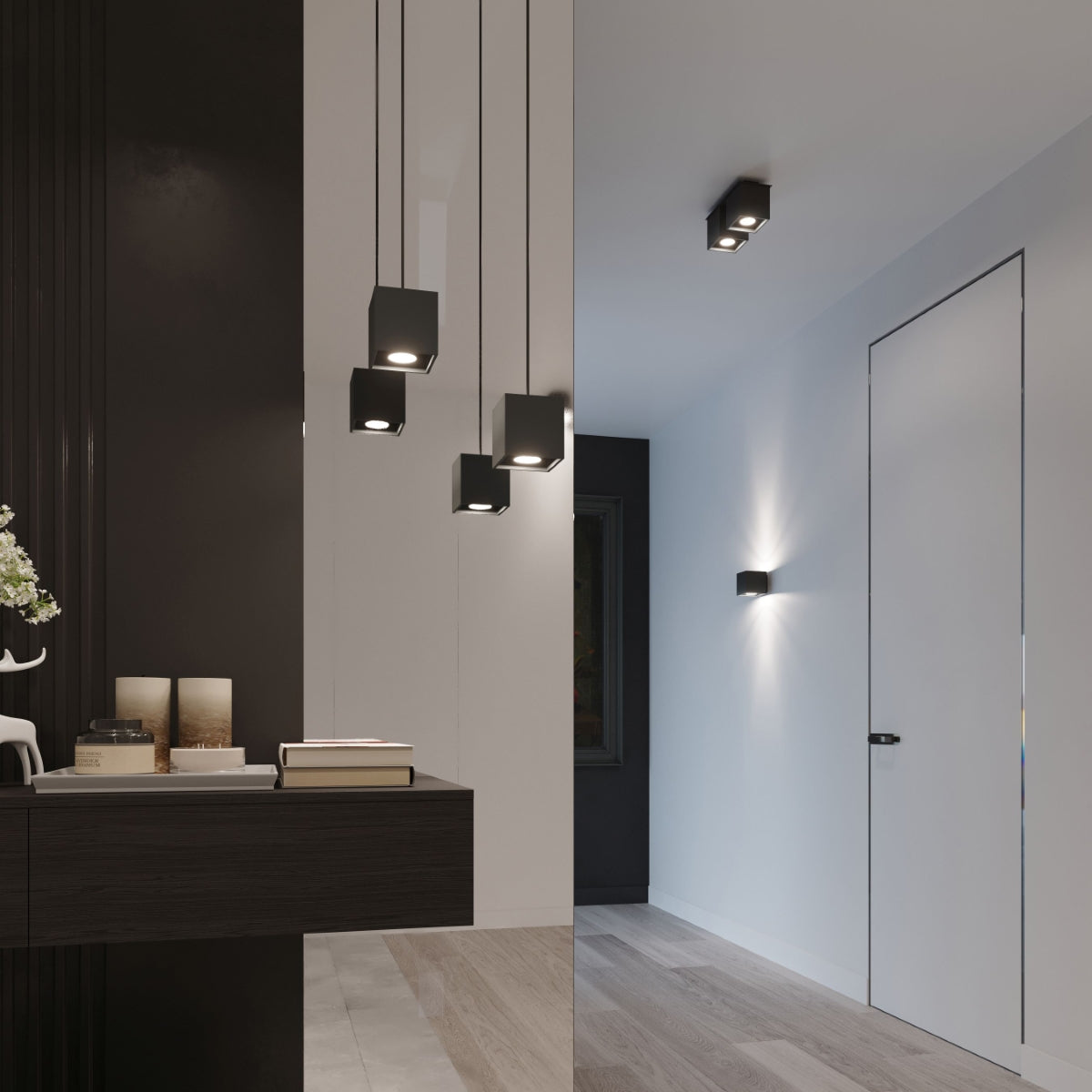 Modern black cube wall light from Sollux Lighting installed on white walls in a contemporary indoor space