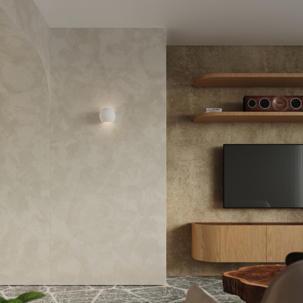 Sollux Lighting modern ceramic wall lamp mounted on beige textured wall next to wooden shelves and TV