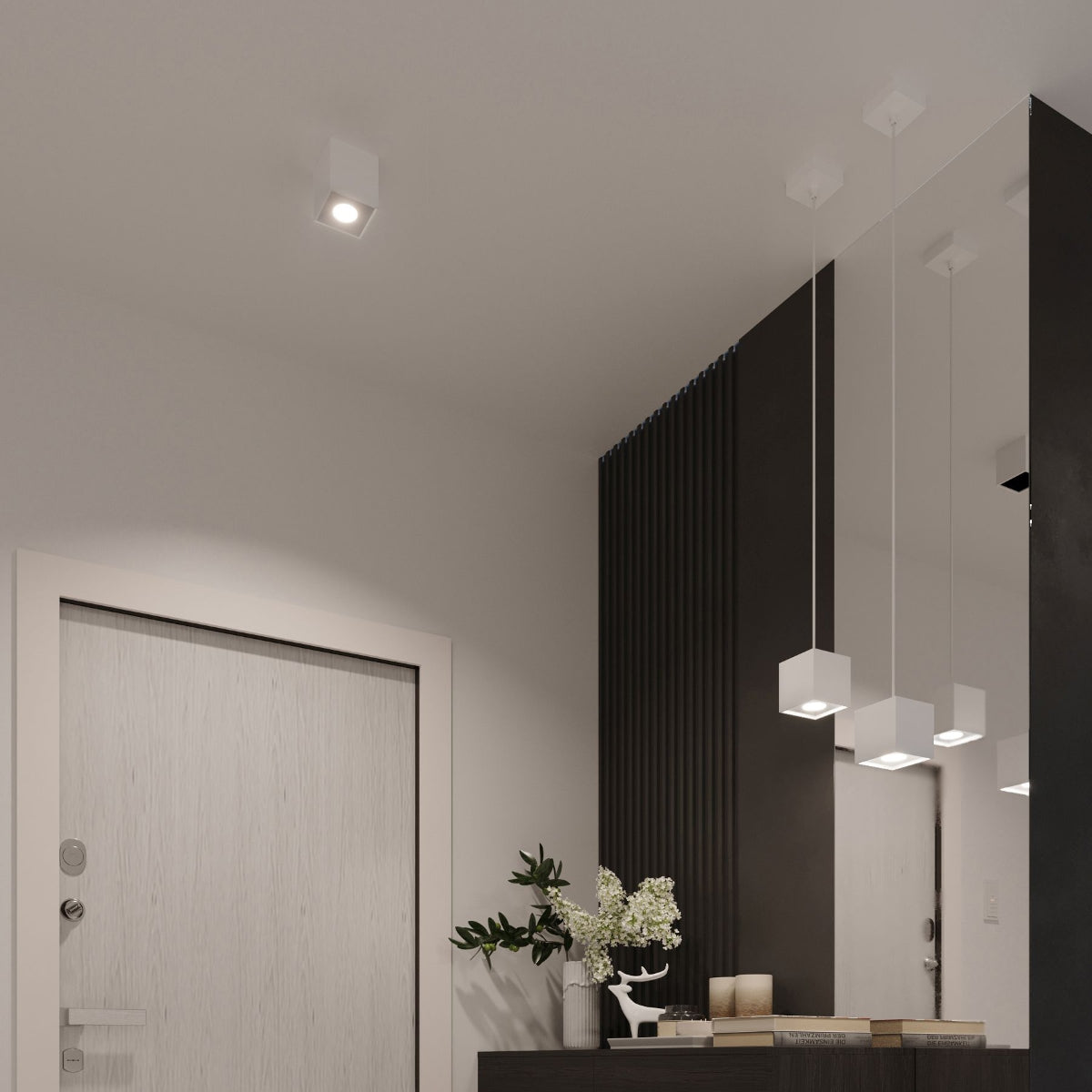 Modern cube white wall lamp from Sollux Lighting illuminating a minimalist interior with black and white decor
