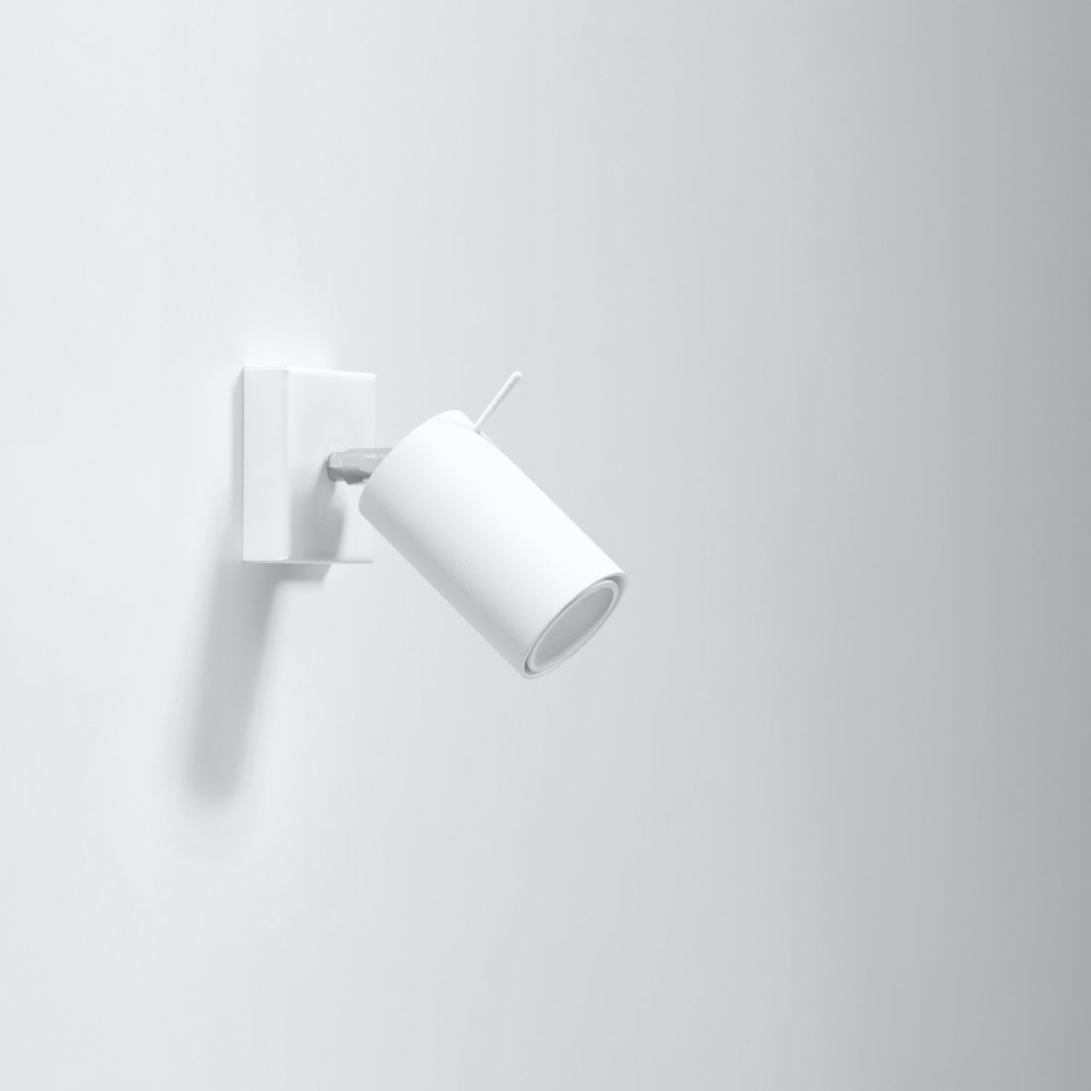 RING White Minimalist Wall Lamp featuring a modern design and adjustable light direction.